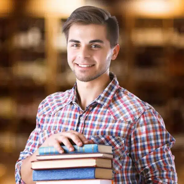 man holding books