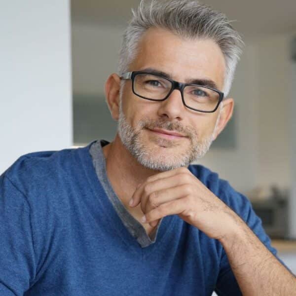 man grey hair glasses