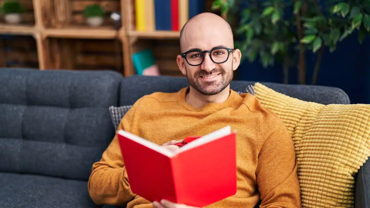 man on sofa reading book(1)