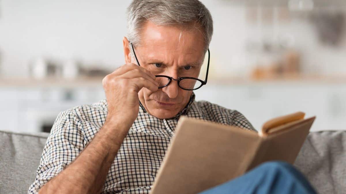 15 Smart Ways Retirees Cut Costs Quietly man reading a book