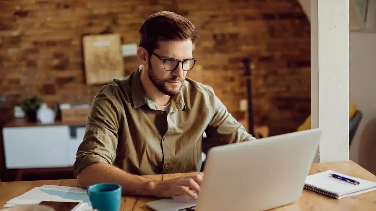 man-with-glasses-working-on-a-computer